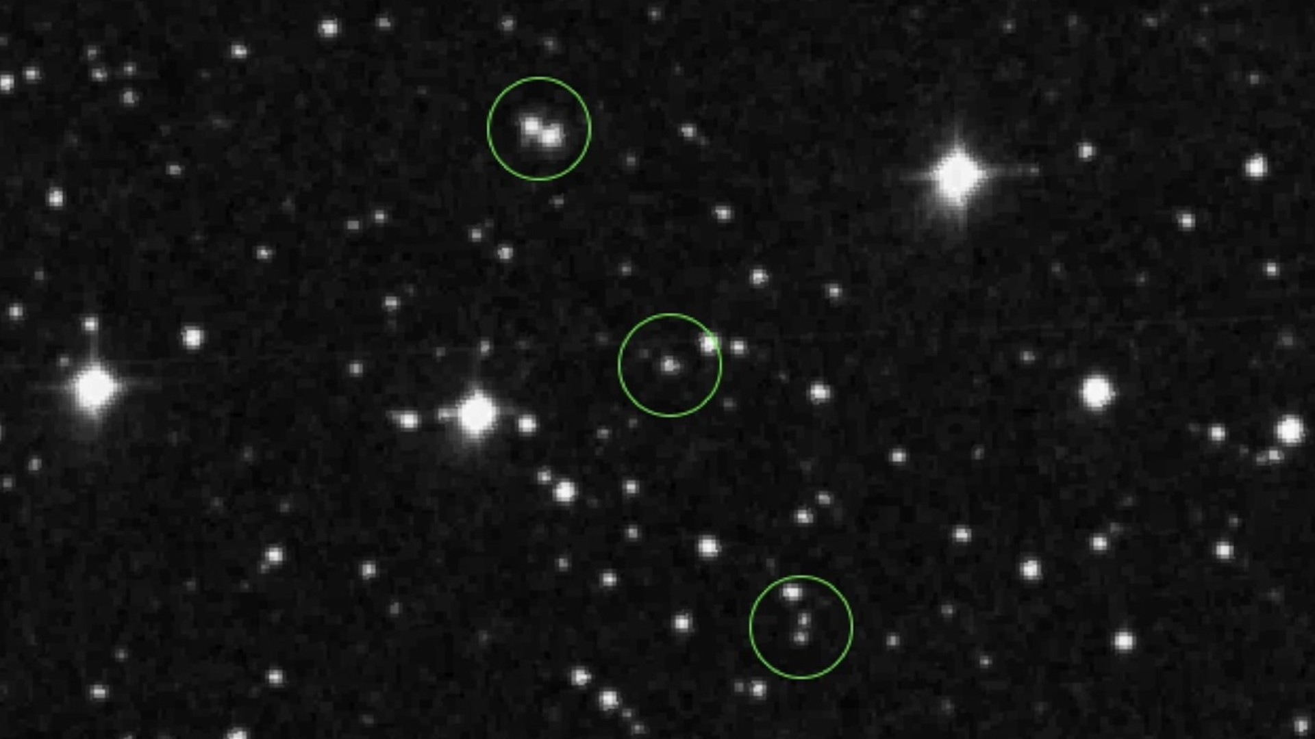 images of stars on a black background, with what appear to be other stars among them circled by dotted lines